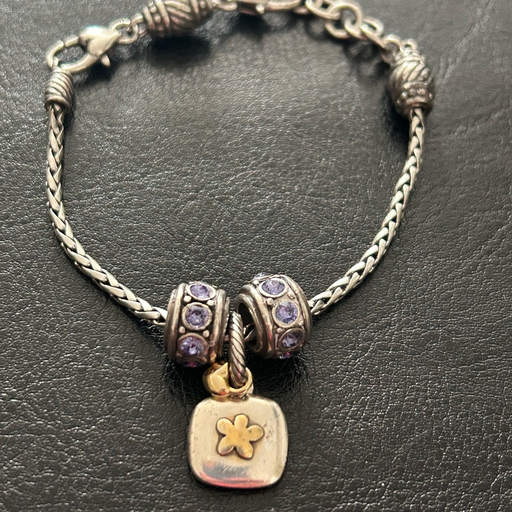 Brighton barrel slide bracelet with 3 charms. One Sister, and 2 amethyst slides.